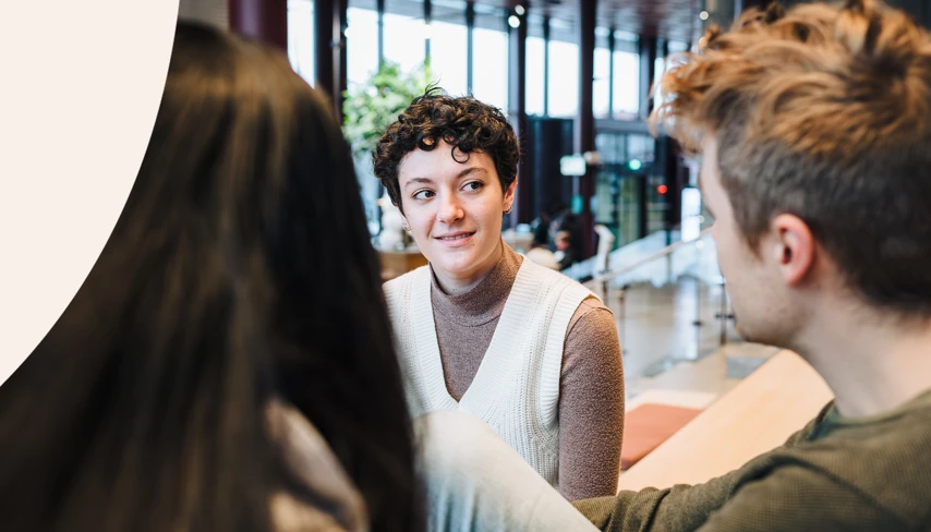 A picture of three students talking