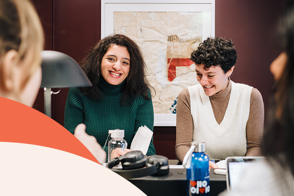 A picture of two students talking and laughing 