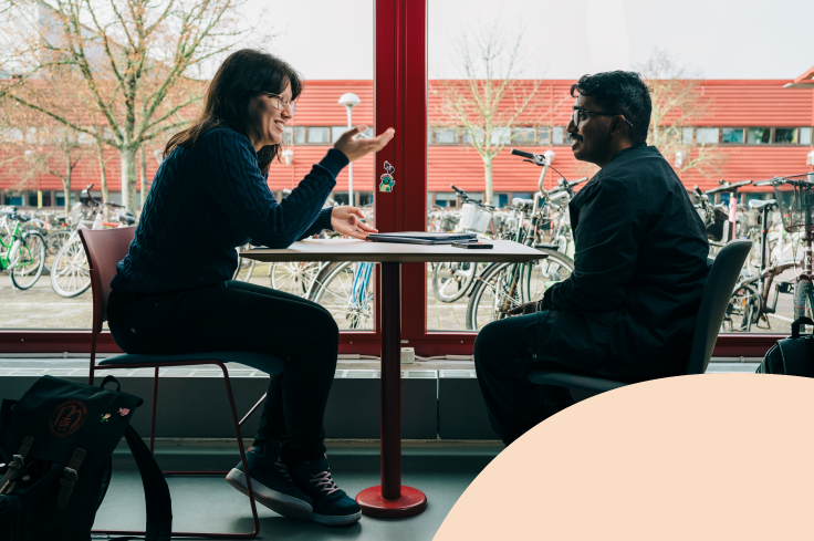 Photo of two students talking
